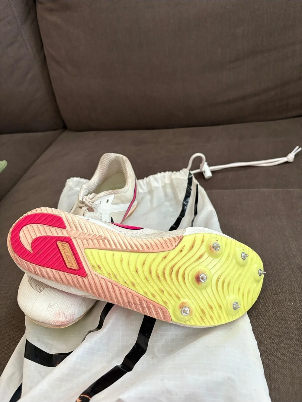 Nike Cream Mesh Running Track Spikes with Pink Swoosh Accent